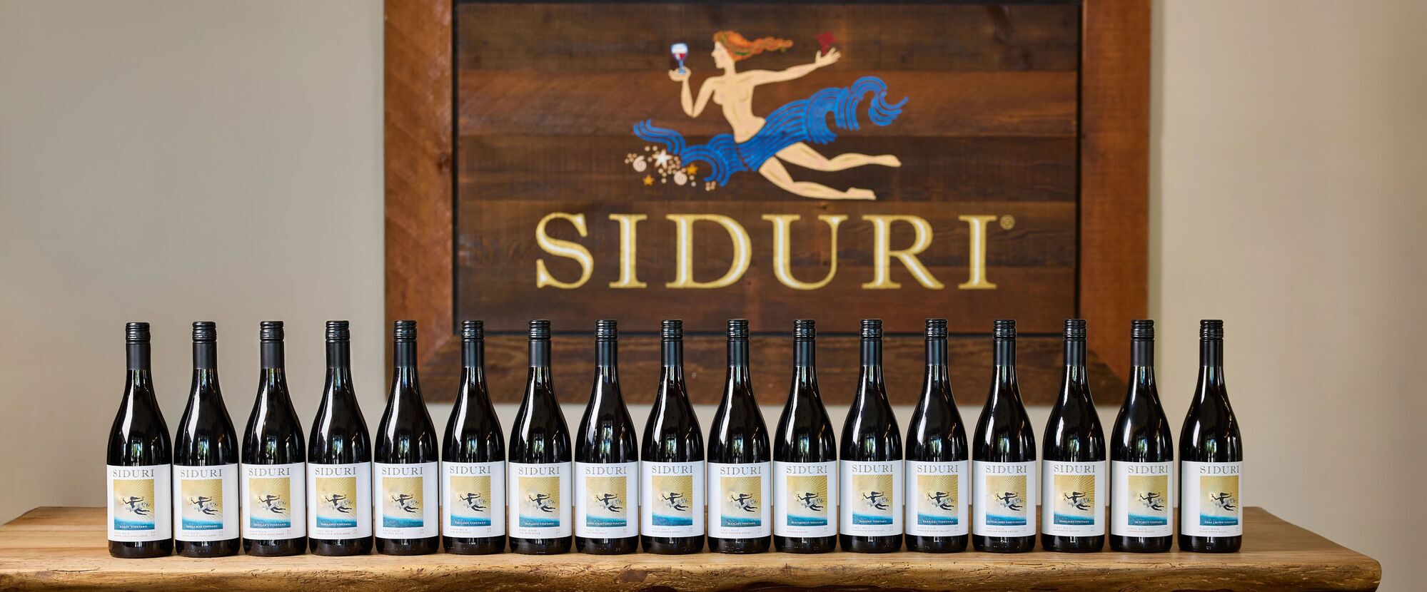 A lineup of siduri wine bottles